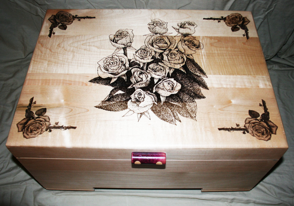 A beautiful jewelry box by the Yanneys. Woodmaster created the flat surfaces; their laser cutter created the floral designs.