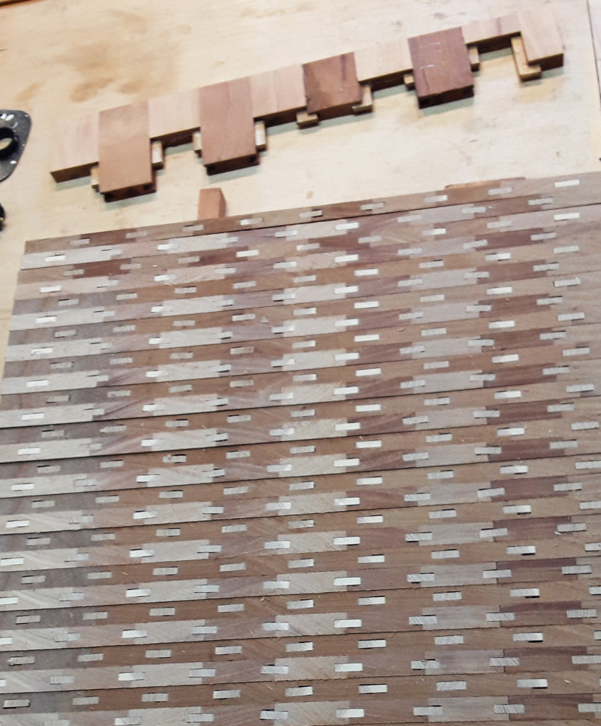 Check it out — Stuart saws the glue-up into strips, turns them on edge, and re-glues them to make his intricate patterns.