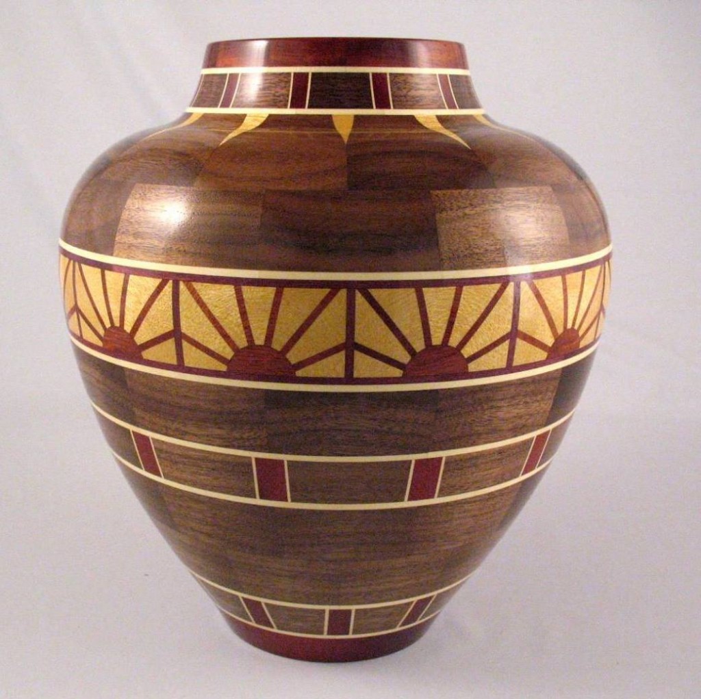 Pete Marken's "Rising Sun" vase is 9-1/2” diameter X 10-1/2” tall - Woods used: Walnut, Yellowheart, Bloodwood and Holly. 551 pieces of wood