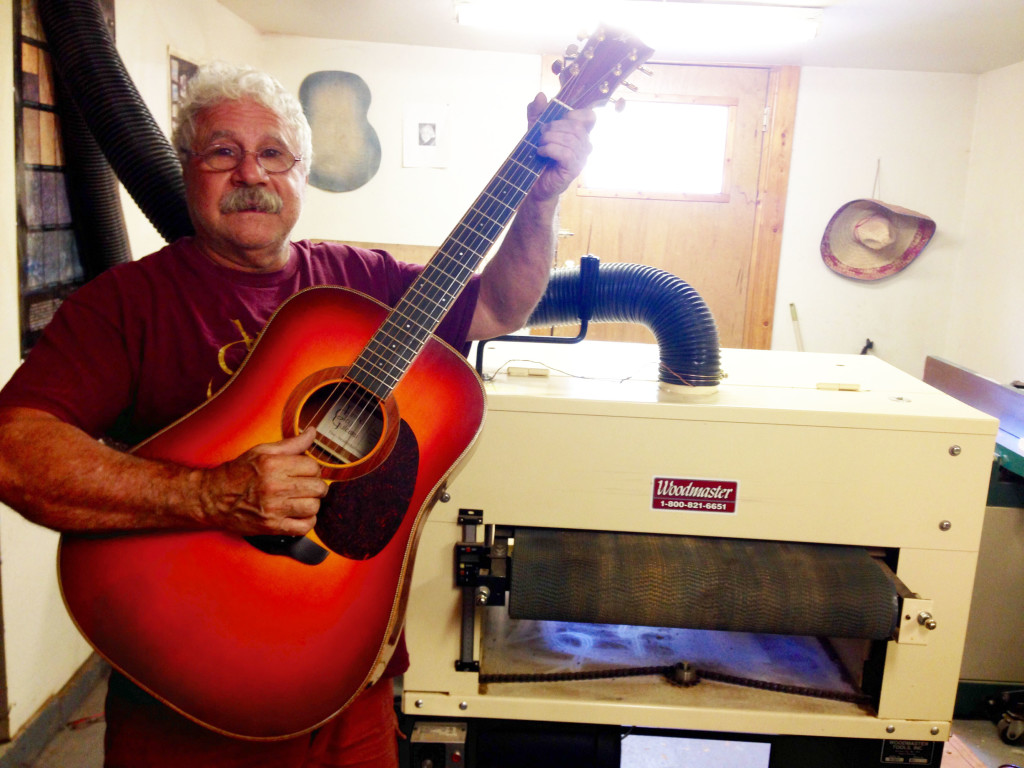 Here's John with one of many guitars he's made, and the Woodmaster Drum Sander he uses to make them.
