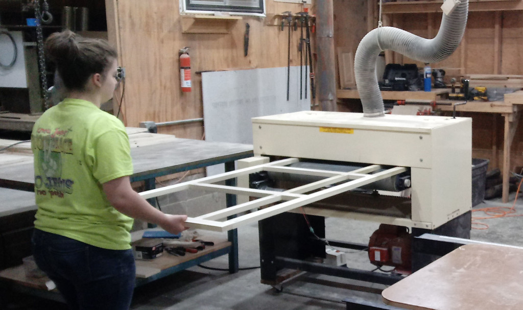 Daughters, too, get involved in Ray's family furniture business. Here's Destinee running a face frame through their Woodmaster Drum Sander.