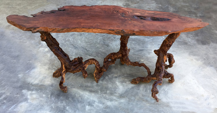 Matt emphasizes woods' natural beauty in his clean, sophisticated woodworking pieces like this live edge accent table
