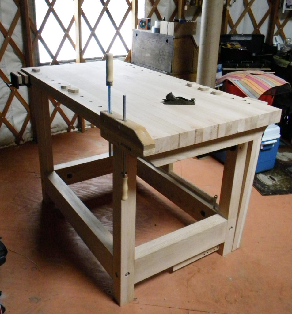The 24" x 48" maple workbench was made for a young couple currently living in a yurt. They use the wooden clamp mounted at one end to hold workpieces they’re carving.